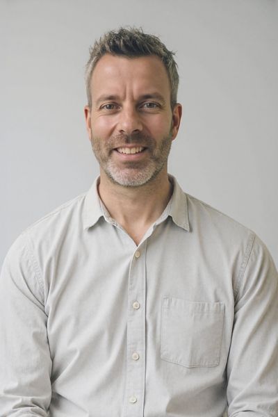Kevin is a white man with short hair and a cropped beard